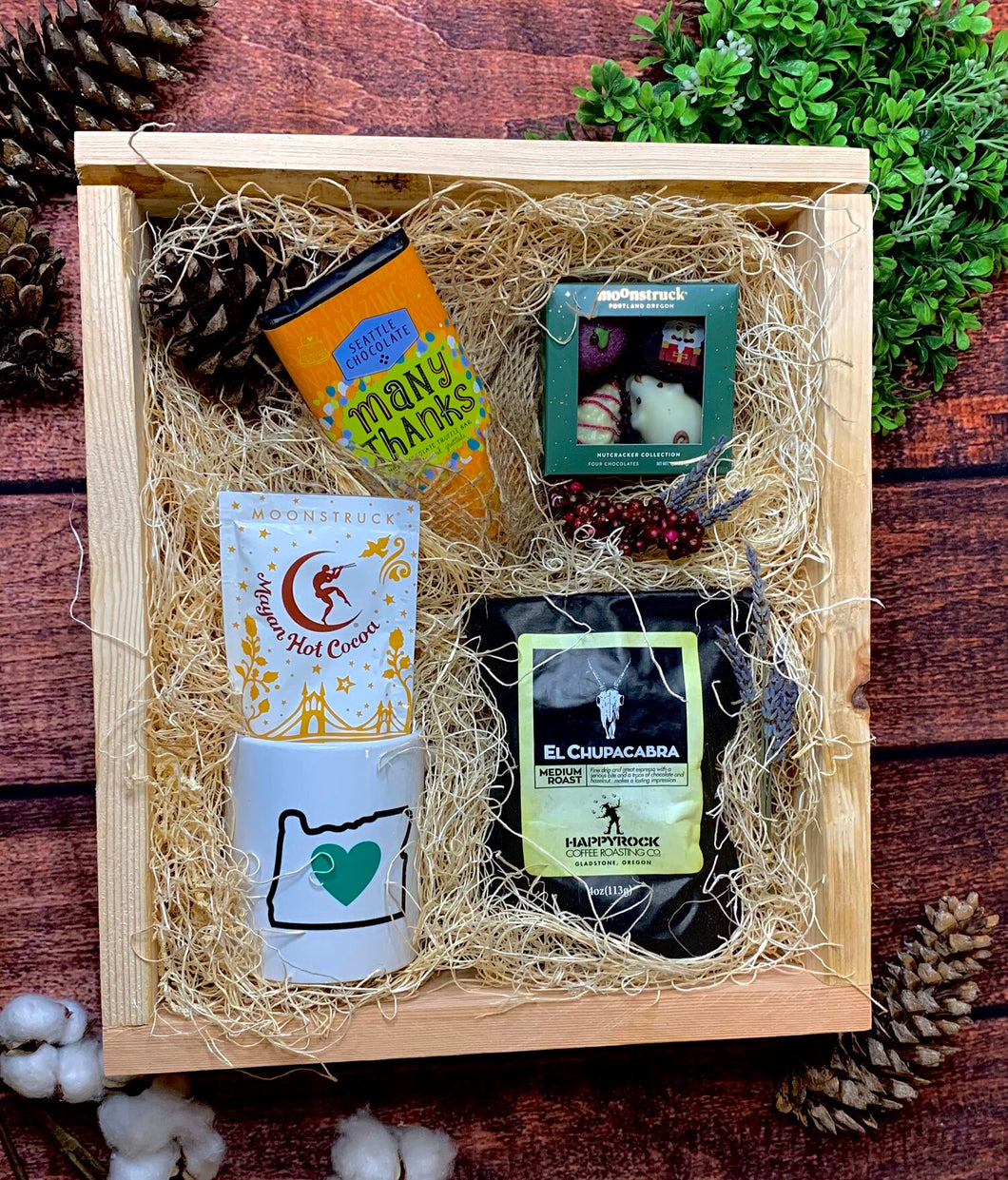 Sample box containing Oregon Luv mug, hot chocolate, coffee beans, chocolate truffles, chocolate truffle bar.