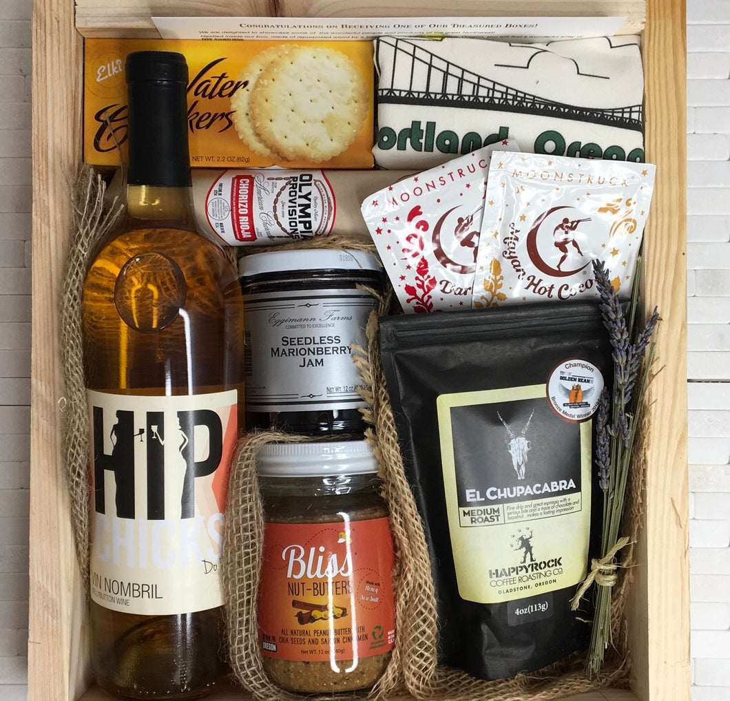 Sample box containing wine, nut butter, coffee, drinking chocolate, salami crackers, and Portland Oregon tea towel.