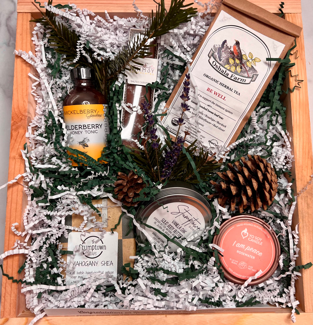 Gift box containing Elderberry tonic, Whimsy salted caramels, Be Well loose tea, Stumptown soap and solid body butter, Local soy candle