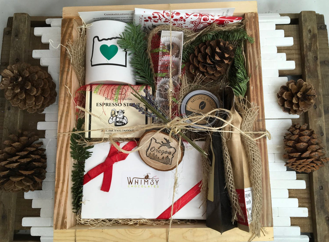 Sample box containing coffee beans, chocolate truffles, Oregon Luv mug, candle,  and Douglas fir Oregon ornament. 
