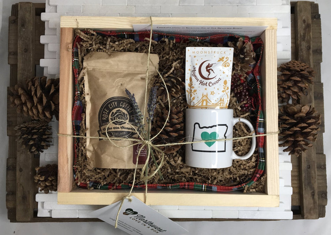 Sample box containing coffee beans, an Oregon Luv mug, and hot chocolate.